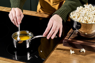 Melted butter being stirred in a HexClad .5QT Milk Pot