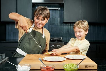 Kids pulling apart Cheese Crusted Quesadilla for cheese pull