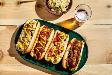 Traditional Ocktoberfest sausages on a wooden table with a glass of beer