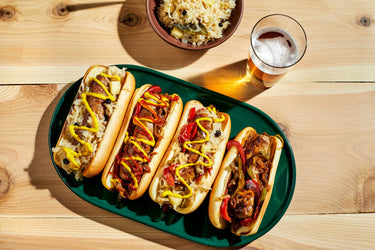Traditional Ocktoberfest sausages on a wooden table with a glass of beer