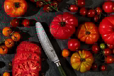 Tomatoes surrounding a 5" HexClad Bread Knife