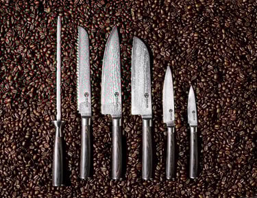 Damascus Steel Knife Set, 7pc w/ Block - Espresso Handles on a bed of espresso beans