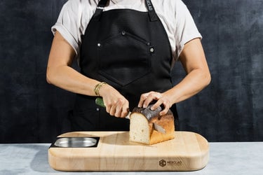 sharpened serrated knife cutting bread