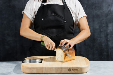 sharpened serrated knife cutting bread