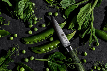 HexClad Paring Knife in a bed of peas