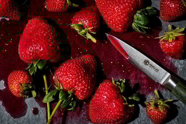 Juicy strawberries next to a HexClad Paring Knife
