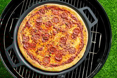 Grilled Pepperoni Pizza on pizza steel placed on top of grill plate