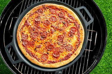 Grilled Pepperoni Pizza on pizza steel placed on top of grill plate