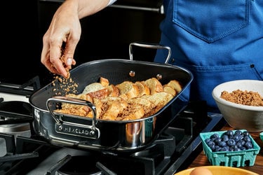 Brown Sugar-Cinnamon Crunch French Toast Casserole being assembled in a Small Roasting Pan