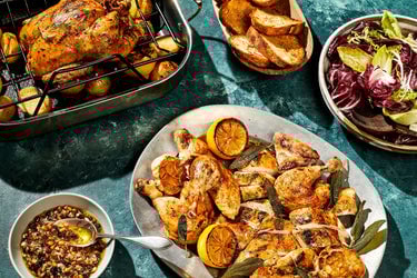 HexClad Perfect Roasted Chicken With Pinenut & Currant Salad plated in front of the small roaster