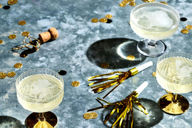 glasses of Champagne with noisemakers