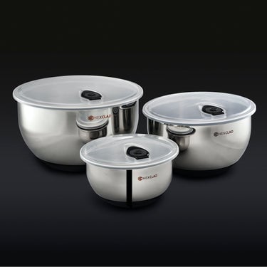 3 HexClad stainless steel mixing bowls with vacuum seal lids on a black background.	