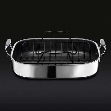 The HexClad Hybrid Roasting Pan with a black rack sitting inside inside.