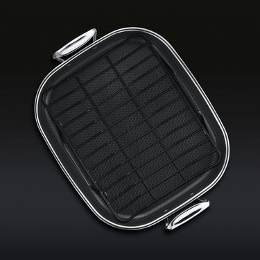 The HexClad Hybrid Roasting Pan with a black rack sitting inside inside, shown from a bird
