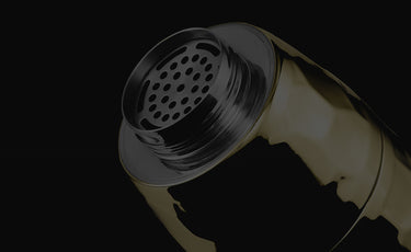 Gold hexclad cocktail shaker with a perforated strainer