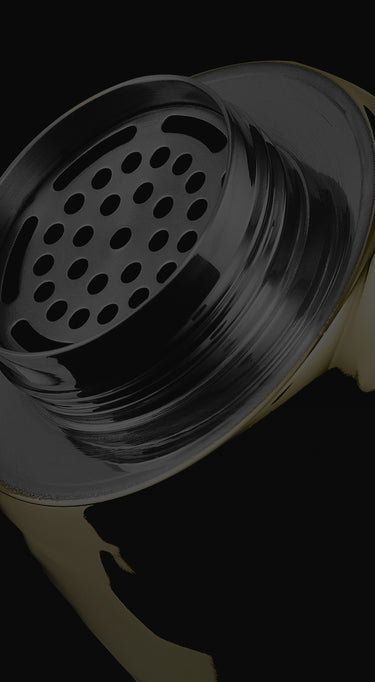 Close-up of the hexclad cocktail shaker open with a dark background