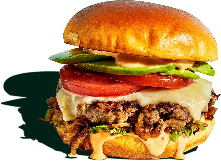 Cheeseburger with avocado, tomato, and caramelized onions.