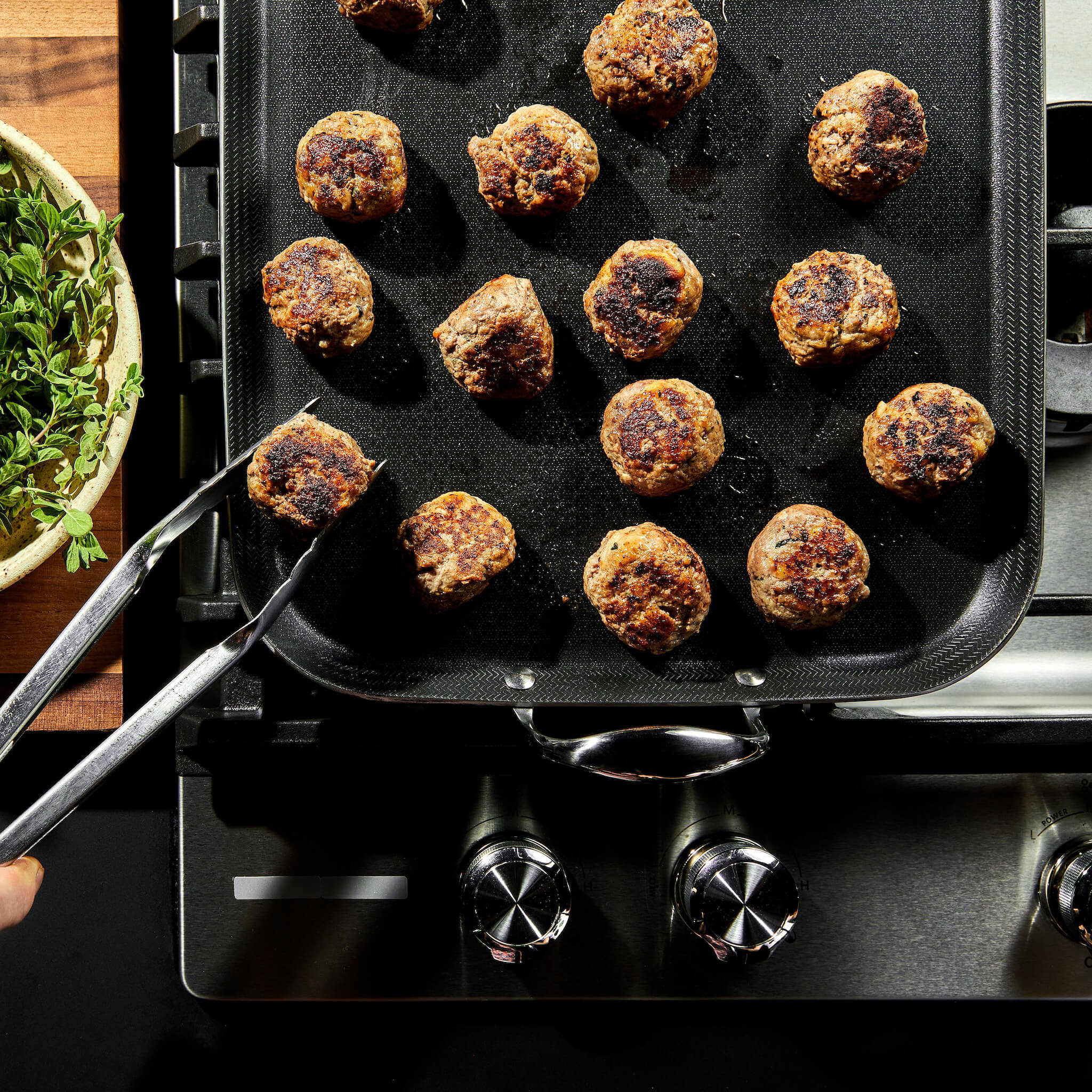 Deliciously seared meatballs on our Hybrid DoubleBurner Griddle the
