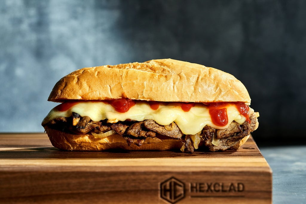 Cheesesteak Sandwich over blue wallpaper