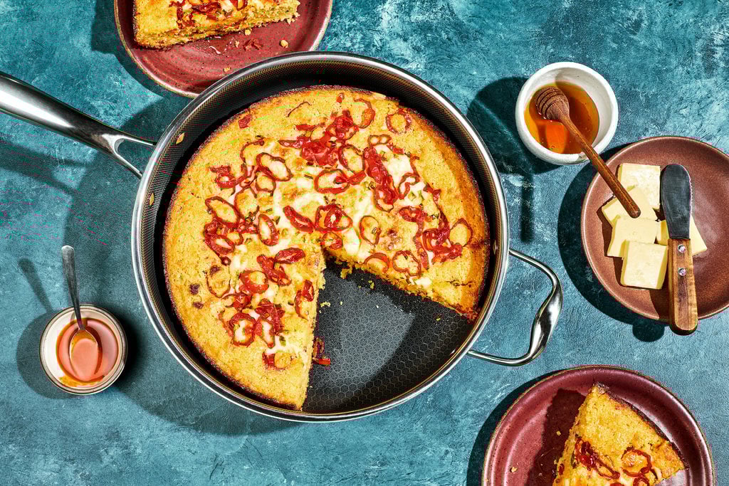 cornbread in pan on blue surface