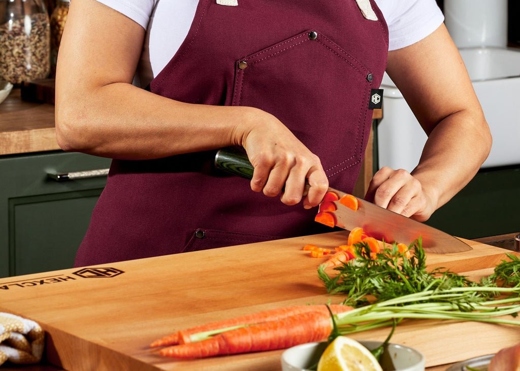Carrots being chopped on cutting board