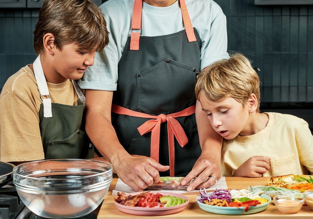 Kids making Rice Paper Rolls with their Mom