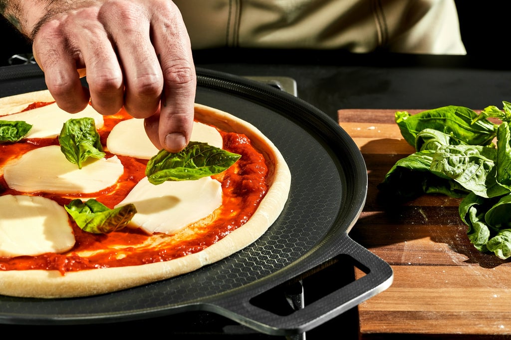 Margherita Pizza being constructed on pizza steel