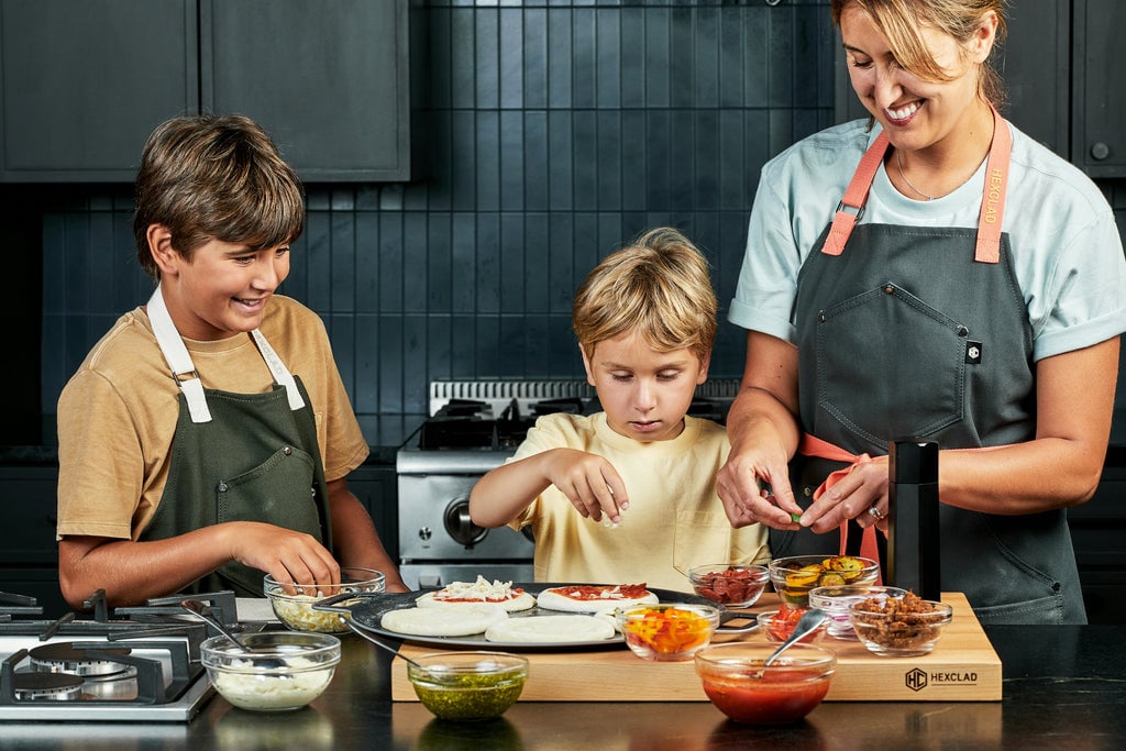 Kids prepping Mini Pizzas on Pizza Steel with their Mom