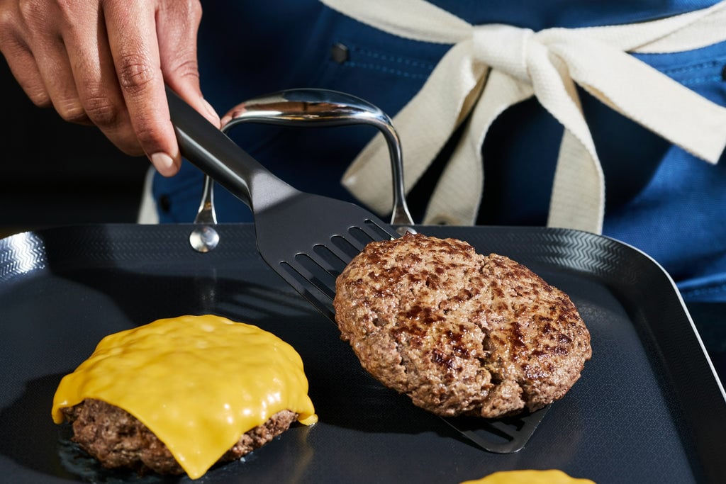 HexClad Fish Spatula flipping burgers on Double Burner Griddle