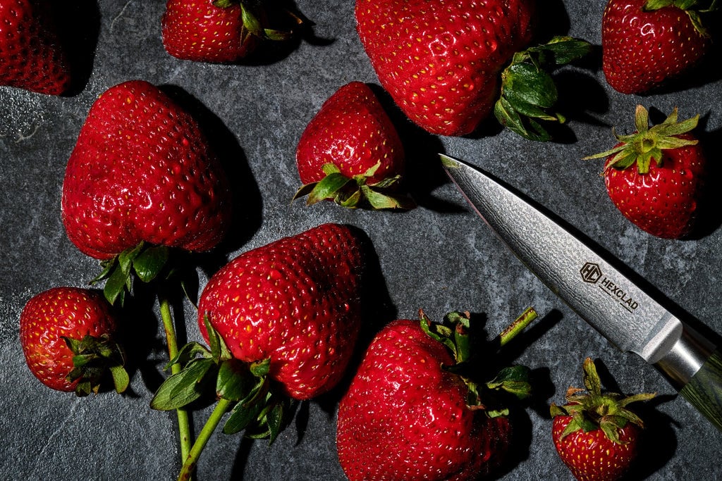 Strawberries next to a HexClad Paring Knife