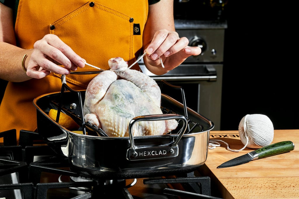 Raw chicken in a small roasting pan