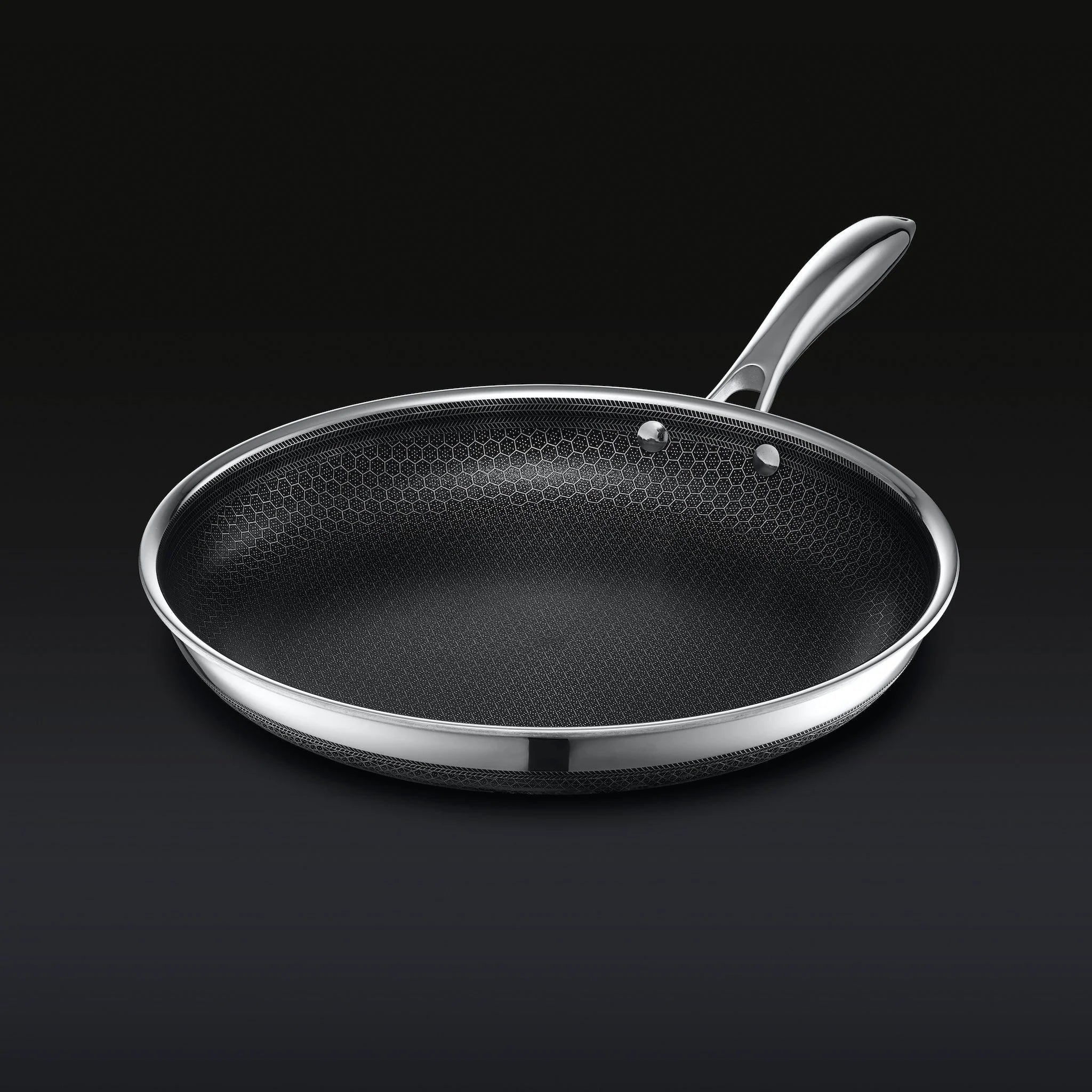 Non-stick frying pan on a dark background.