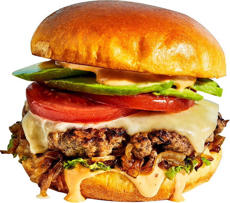 Cheeseburger with avocado, tomato, onions, and sauce.