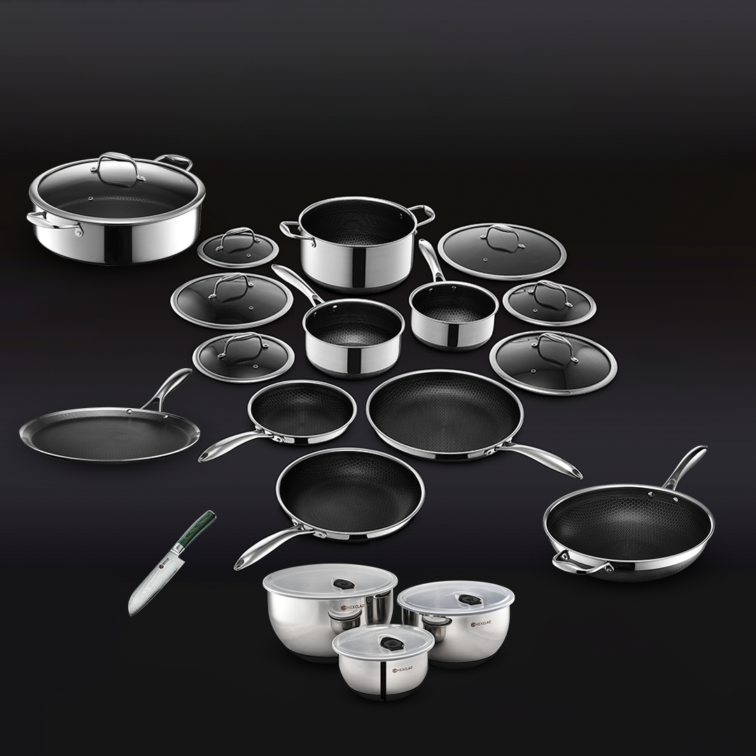 Set of stainless steel cookware with lids and a kitchen knife.
